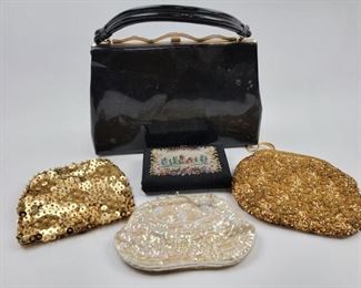 Vintage purses.  The little box purse has a bright pink interior.  