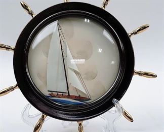 Ships wheel with a boat inside.  Paper sails make this extra special.  