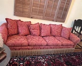 Salmon colored sofa