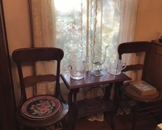 A pair of nice cane bottom chairs in excellent condition and two side tables.