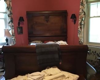 Fabulous bed and mahogany chest at the foot.