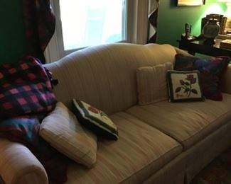 Large comfortable camel back sofa.