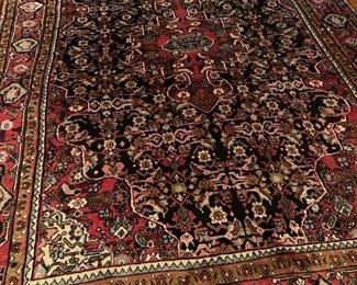 Large Oriental rug in dining room.