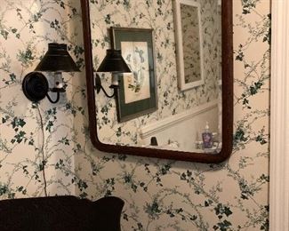 Beveled mirror in an oak frame.