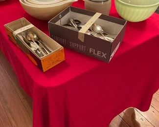 Complete set of nesting bowls and silver plated flatware.