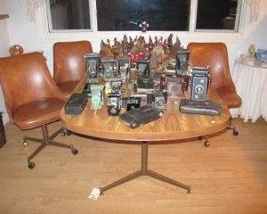 Antique cameras, dining set, and collectibles