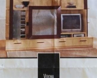 From the House of Denmark...this Ent. center has a sliding door when centered it houses a group of shelves. Slide it over to cover the TV. We have the directions for dissembling and reassembling. Approx 10' wide