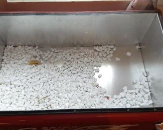 The inside of the chest Coke machine