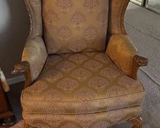 Vintage Upholstered chair with carved eagle arms. $95