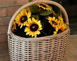 large basket with faux sunflowers