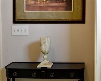 table, framed art, lamp