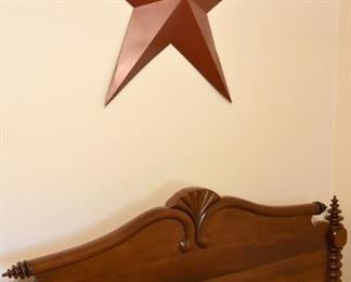 twin-size bobbin/spool bed (detail), large red metal star