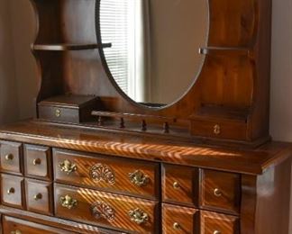 dresser with mirror and boxes