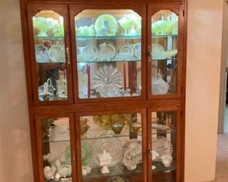 This beautiful cabinet China hutch is one piece and it’s just simply beautiful with all the glass 76 tall 56 1/4 wide 12 1/4 deep