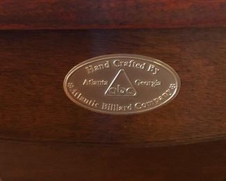 That says, "Cher and Holly will kick your butt at pool."