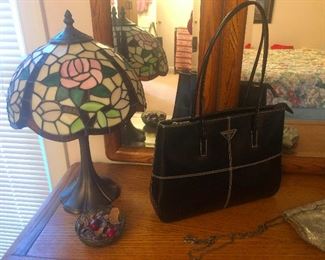 Tiffany style lamp and Prada bag walked into a bar