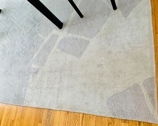 $695 - Calvin Klein rug, dining room with minor wear consistent with use; 12' 10.5" x 9' 3"