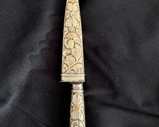 $85 - Knife with decorative handle and sheath; 10" L. Argentina JC-CA