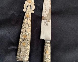 Detail, knife and sheath