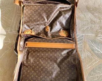 $995 -Louis Vuitton folding garment bag. 40"L (open) x 24"W x 6"D