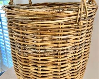 $95 - Woven two-handled basket; 24" H x 20" diameter