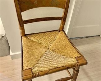 $120 - Hitchcock chair with painted decorations on splat and reed seat; 33" H x 17.5" W x 15.5" depth and 18" chair height 