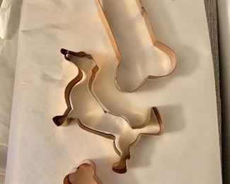 Three copper molds: two dog bones ($12 - 6" L and $8 2.5" L) and $6 - one dog (5.5" L)