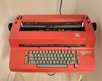 $160 - Vintage red IBM Selectric typewriter; 6" H x 21" L x 14" depth