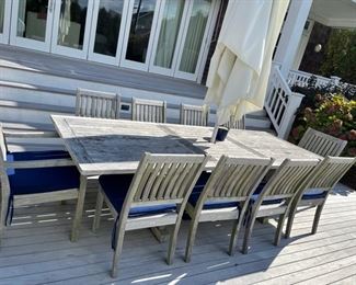 Outdoor teak furniture table and chairs make is Gloster 