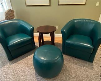 Four pristine condition Pier1 faux leather Duncan swivel chairs and two foot stools. The color is called antique teal. 
