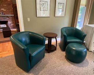 Four pristine condition Pier1 faux leather Duncan swivel chairs and two foot stools. The color is called antique teal. 