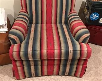 This over stuffed chair with lodge style upholstery.