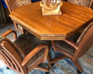 This is a beautiful oak hexagon table (1 leaf) and 4 swivel chairs with beautiful padding.