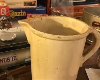 Yellow ware pitcher and look at the games in the background.