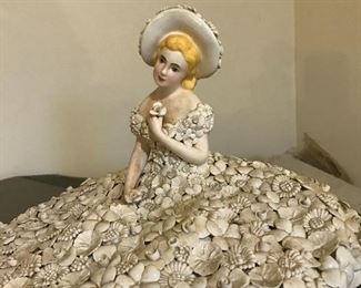 Love this little lady with a skirt, hat and dress made from shells