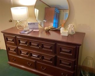 Antique low dresser, round modern mirror
