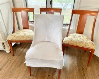 Set of four dining chairs with 4 white canvas slipcovers 