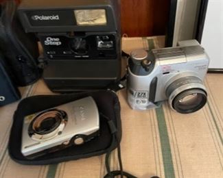 Canon Power Shot digital camera, Polaroid One Step, Olympus Camedia 