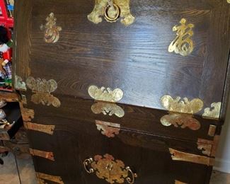 The brass adornments really make this piece. 