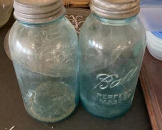 Large blue Mason jars with metal screw lids