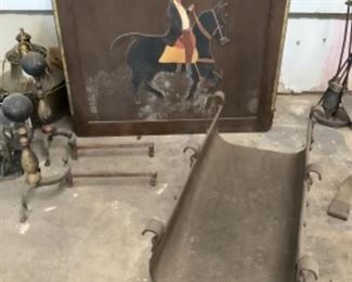 Handmade firescreen and large metal log holder, andirons, and other fireplace tools
