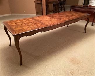 Vintage Wood dining room table, with two leaves and cabriolet legs