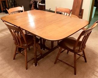 Dining table, three leaves & pads and four sturdy side chairs