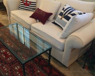 Sleeper sofa, nautical pillows, metal coffee table and end tables