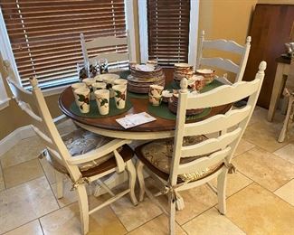 Beautiful Canadel dining table with 6 chairs and one leaf. Some of the Franciscan Apple dishes.