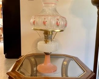 quilted Aladdin lamp with pink base, hand painted Aladdin shade, shown on a 1980’s glass top oak end table