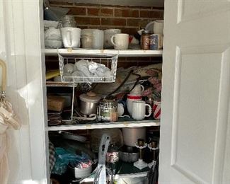 Storage closet for milk glass, lamps and parts before sorting.