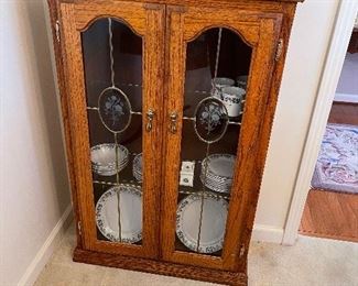 Oak dish cabinet with leaded glass windows