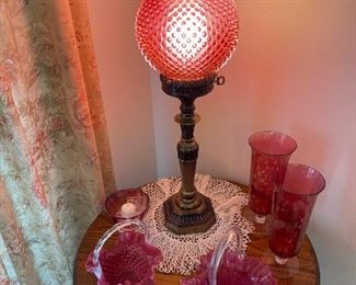 Fenton Cranberry lamp, and baskets, oak lamp table