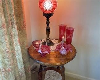 Fenton Cranberry lamp, and baskets, oak lamp table